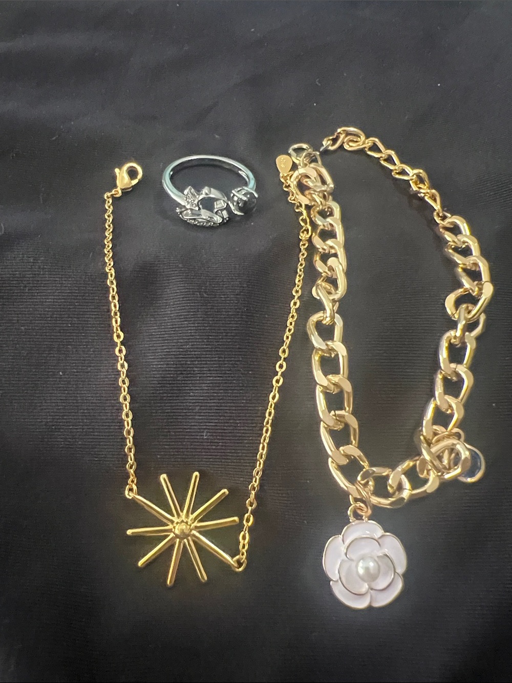 Gold Starburst Necklace and Gold Chain Bracelet with White Flower Charm